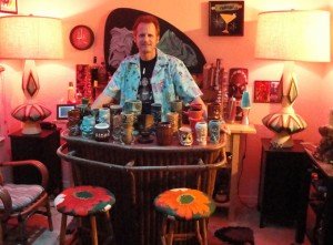Hurricane Hayward shows off his Tiki mug collection in his home bar shortly after the launch of The Atomic Grog in 2011. (Atomic Grog photo)