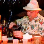 The first contestant, George Jenkins, makes his drink, The Rain Barrel. (Photo by Go11Media.com)