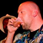 Martin Cate, owner of Smuggler's Cove in San Francisco, samples the first rum barrel. (Photo by Go11Media.com)