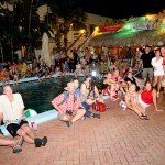 The poolside crowd is riveted by the competition. (Photo by Go11Media.com)