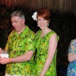 Hukilau organizer Christie "Tiki Kiliki" White (far right) announces the winning drink, The Moon Barrel. While his wife Nicole looks on, Joe Desmond marvels at his prize: A custom-sculpted, hand-carved muddler by South Florida artist Tom Fowner. (Photo by Go11Media.com)