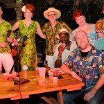 Rum Barrel Master Mixologist champion Joe Desmond is joined by his wife Nicole, the judges, host Beachbum Berry, contest coordinator Hurricane Hayward and Hukilau organizer Christie White. (Photo by Go11Media.com)