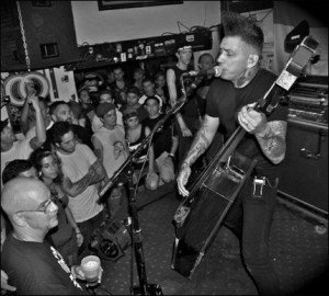 Kim Nekroman plays his "coffin bass" at Churchill's in Miami on July 20, 2010. (Photo by Moe)