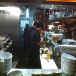 Executive chef Roy Villacrusis (far right) works with his kitchen staff at Kapow! in Boca Raton.