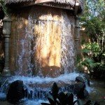A cascading fountain greets guests in the pre-show area of Walt Disney World's Enchanted Tiki Room (November 2011).