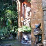 Claude and Clyde's fountain is surrounded by authentic Tikis and foliage (November 2011).