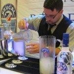 A Brugal Rum rep pours classic Bee's Knees cocktails during the Grand Tasting at the Miami Rum Festival on Saturday, April 26