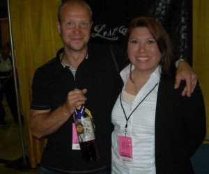 Lost Spirits Distillery co-founders Bryan Davis and Joanne Haruta show off their award-winning Navy Style Rum at the 2014 Miami Rum Festival