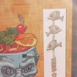 A slide featuring Shrunken Zombie mug artwork also included a piranha swizzle stick design that was never used ... yet