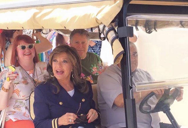 Dawn Wells appears happy and surprised to see the large turnout of colorful villagers as she arrives with The Hukilau's Christie "Tiki Kiliki" White (left). Many guests were in stylish garb to participate in the Gilligan's Island costume contest. (Jim Masterson photo)