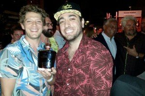 Bartenders Gui Jaroschy (left) and Randy Perez of The Broken Shaker celebrate their victory in The Art of Tiki: A Cocktail Showdown at the South Beach Wine & Food Festival on Friday, Feb. 26. Among the prizes was a rare bottle from sponsor Rhum Barbancourt. (Atomic Grog photo)