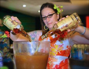 Tonga Hut mixologist Marie King creates a special drink featuring sponsor Sailor Jerry rum during the Modernism Week party Feb. 12 at the Caliente Tropics in Palm Springs.  (Photo by Kari Hendler from Poly Hai)