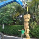 Will Anders directs the lowering of King Kai into the parking lot behind The Mai-Kai in preparation for its installation on May 21.