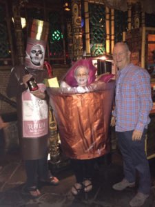 Accepting a bottle of 12-year-old rum from Charlie Kleinicke of Appleton, the first-place winners (Mai Tai and a Bottle of Rum) also took home $300 cash and a $50 Mai-Kai gift certificate